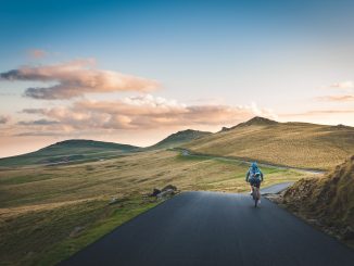 cyclist on mountain hilly terrain road